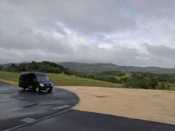 Master Wine Tours Mercedes Sprinter poses in the beautiful Coombsville appellation at the base of Napa valley.