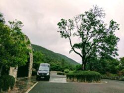 Master Wine Tours Sprinter pulls up to the wine cave of Palmaz Vineyards in Napa, california.