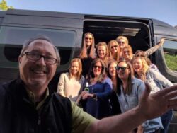 After a wine tour of Sonoma Valley, the group takes a picture with the tour guide to celebrate a great tour.